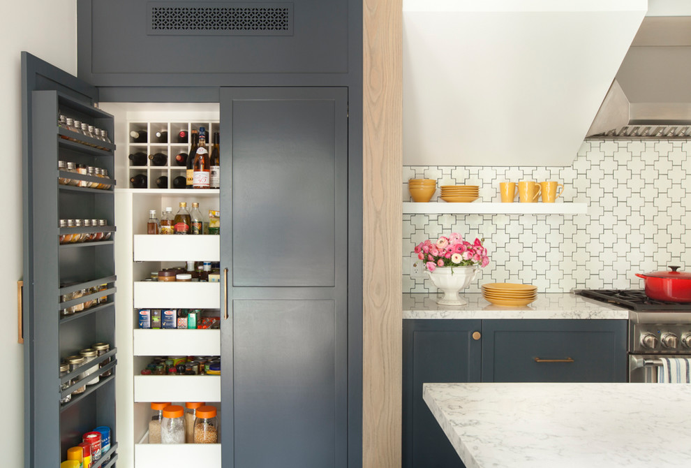 Inspiration for a transitional kitchen pantry in Los Angeles with shaker cabinets and white splashback.