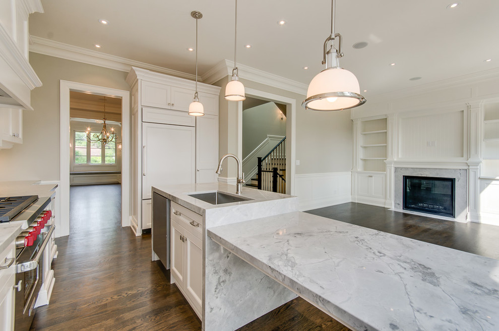 Example of a large transitional l-shaped dark wood floor eat-in kitchen design in Toronto with a single-bowl sink, flat-panel cabinets, white cabinets, wood countertops, white backsplash, mosaic tile backsplash and an island