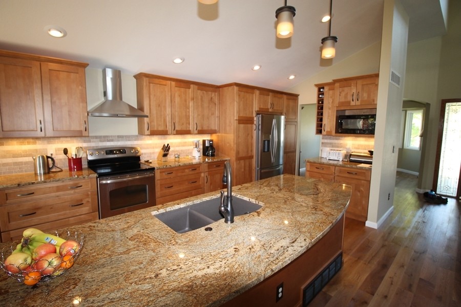 Example of a transitional kitchen design in Denver