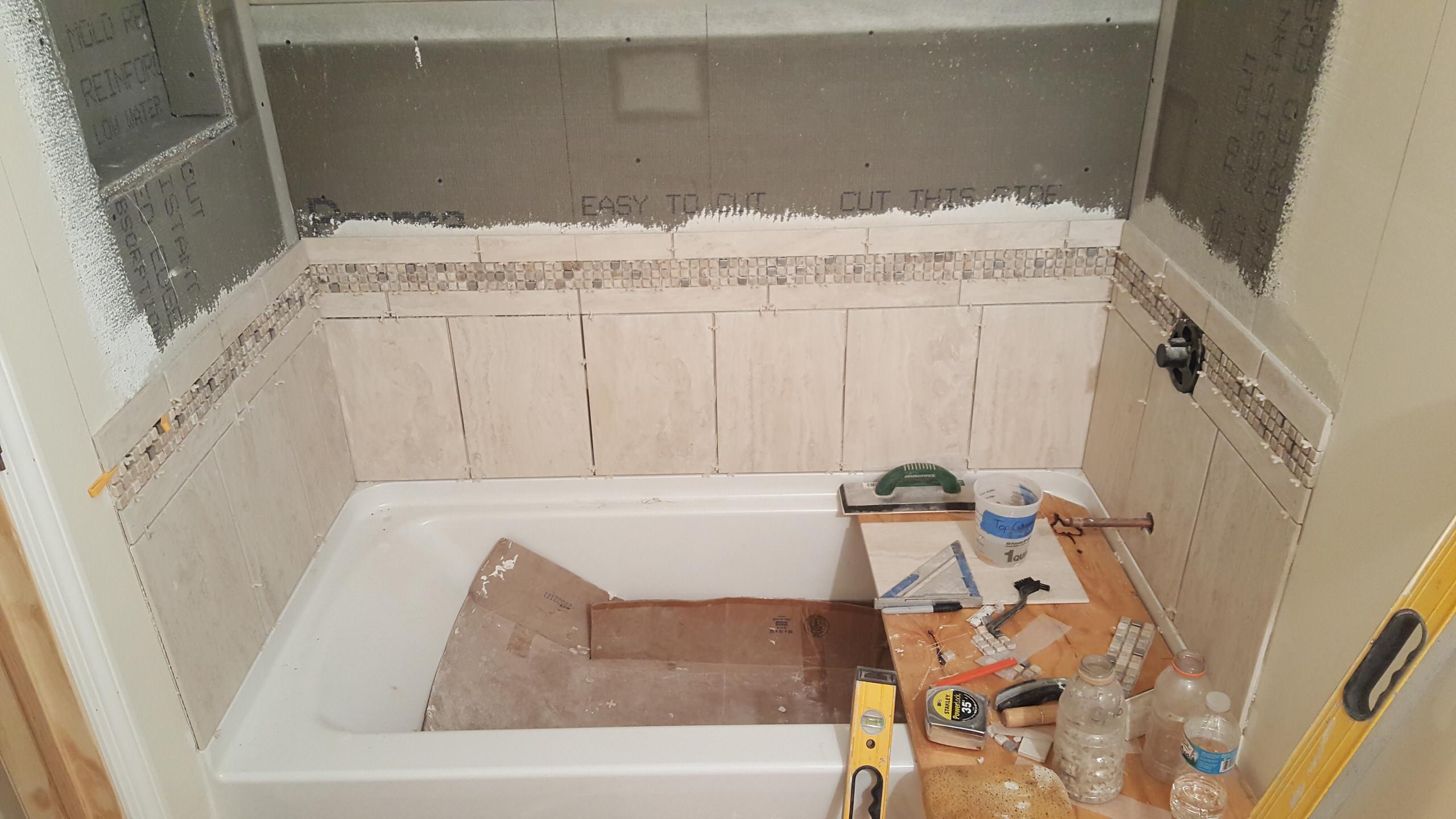 Shower tile getting installed