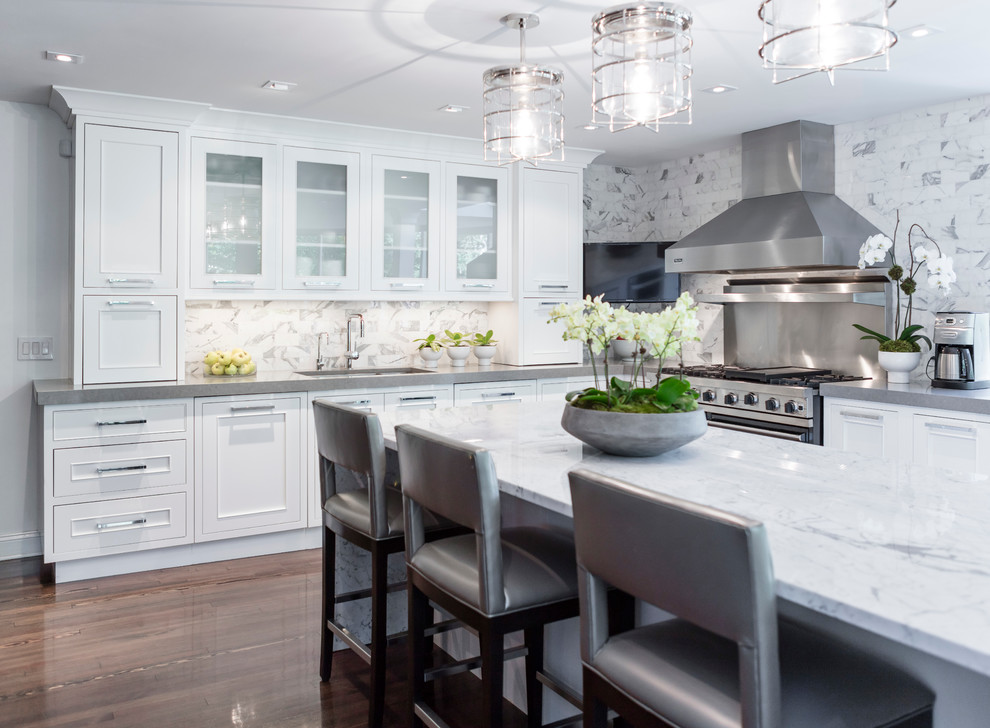 Eat-in kitchen - large transitional galley dark wood floor eat-in kitchen idea in Philadelphia with an undermount sink, recessed-panel cabinets, white cabinets, white backsplash, an island, quartzite countertops, ceramic backsplash and paneled appliances