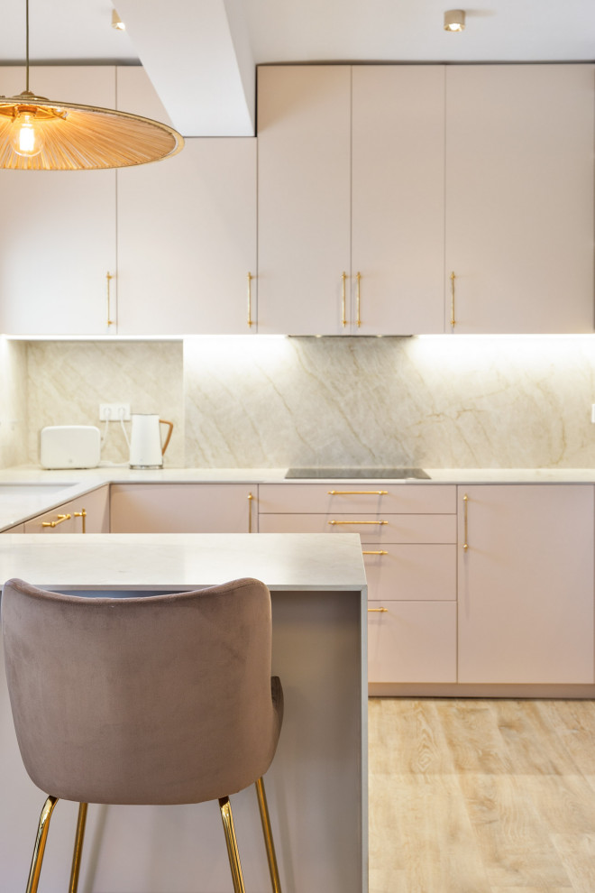 This is an example of a medium sized contemporary l-shaped kitchen/diner in Other with a built-in sink, recessed-panel cabinets, engineered stone countertops, engineered quartz splashback, medium hardwood flooring, a breakfast bar and multicoloured worktops.