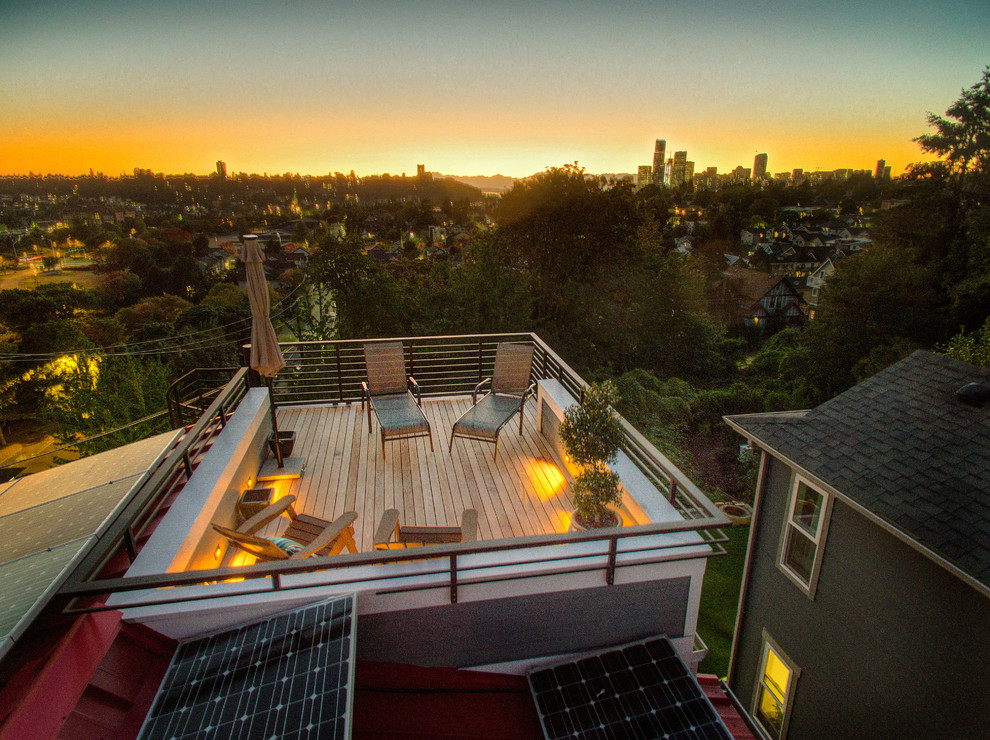 This is an example of a mid-sized transitional rooftop deck in Seattle with no cover.