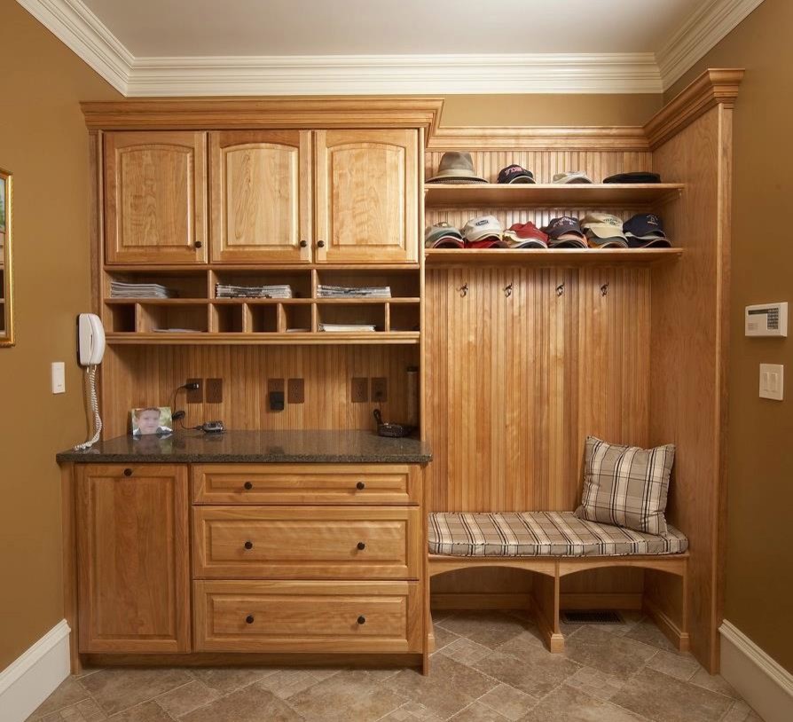 Design ideas for a small traditional mudroom in Boston with yellow walls, ceramic floors, a single front door and a dark wood front door.