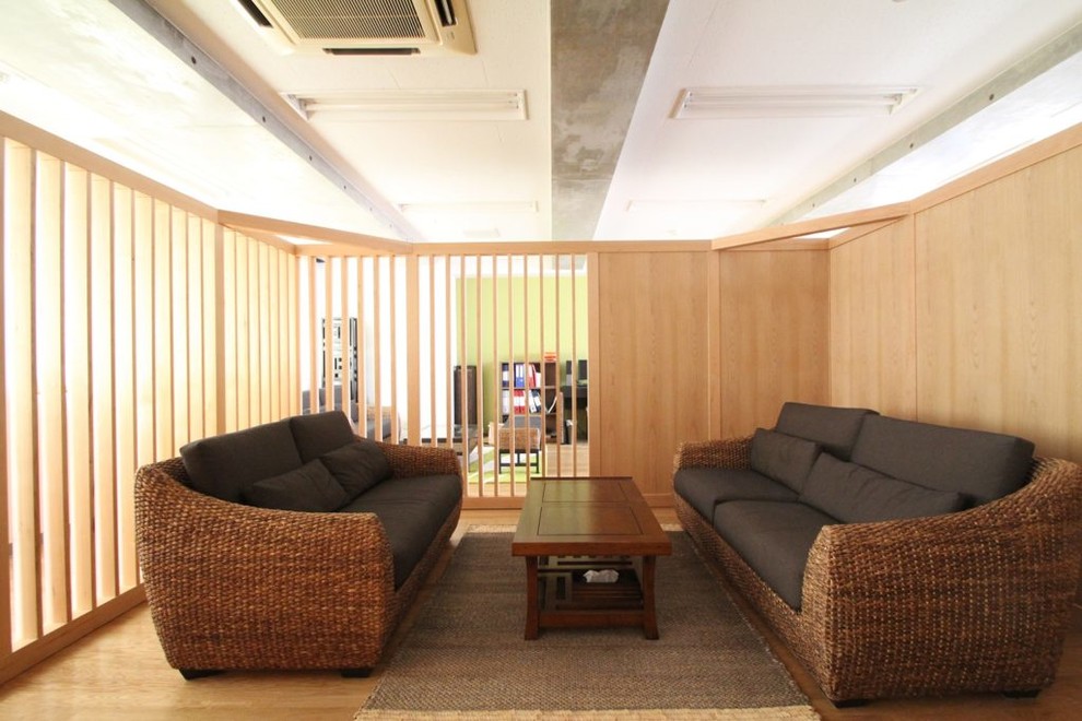 Design ideas for an expansive scandinavian enclosed family room in Tokyo with beige walls, medium hardwood floors and beige floor.