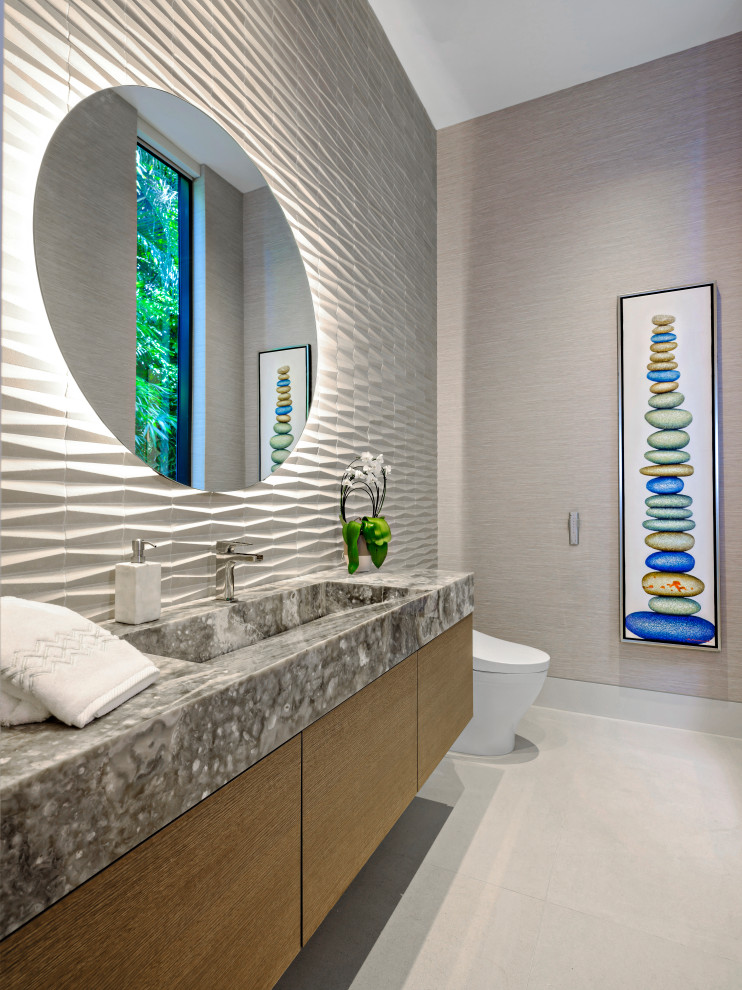 Contemporary powder room in Miami with a floating vanity.