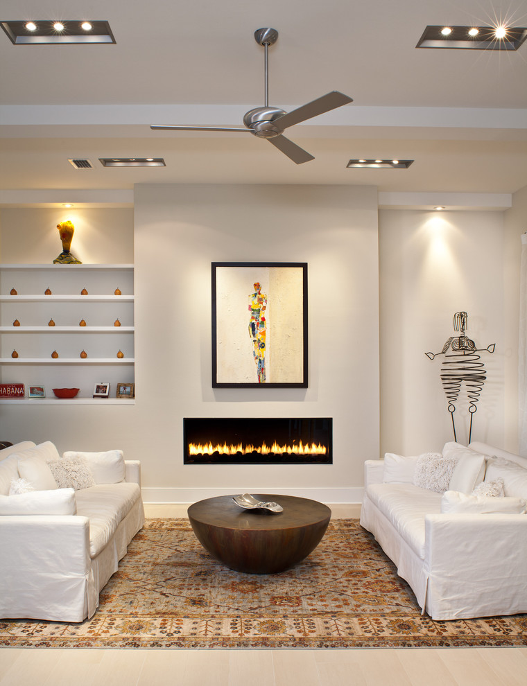 Contemporary living room in Tampa with beige walls and a ribbon fireplace.