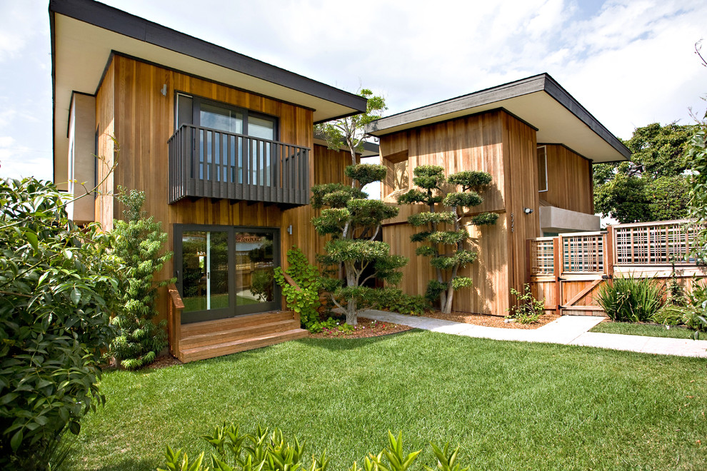 This is an example of a contemporary exterior in San Diego with wood siding.