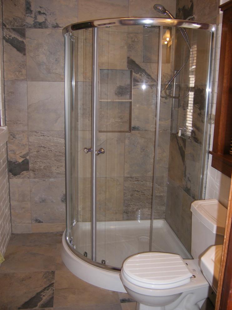 Example of a small minimalist 3/4 multicolored tile and porcelain tile porcelain tile corner shower design in Toronto with a two-piece toilet and white walls