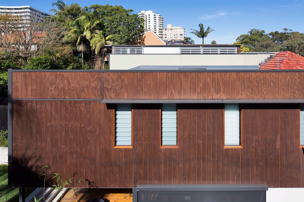 Modern two-storey house exterior in Sydney with wood siding.