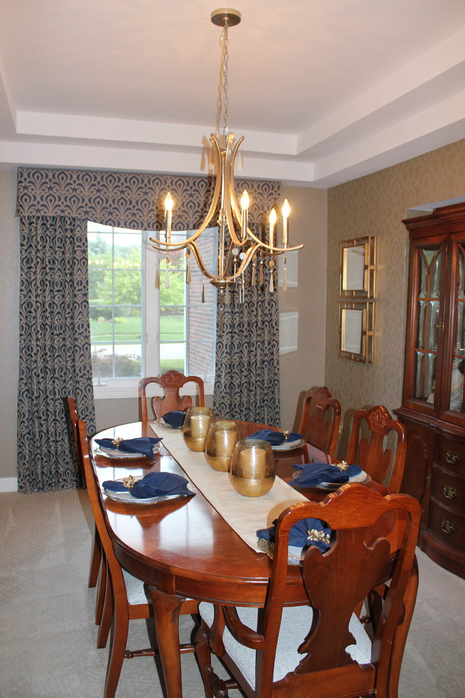 Photo of a small traditional dining room in Other with metallic walls, beige floor and carpet.