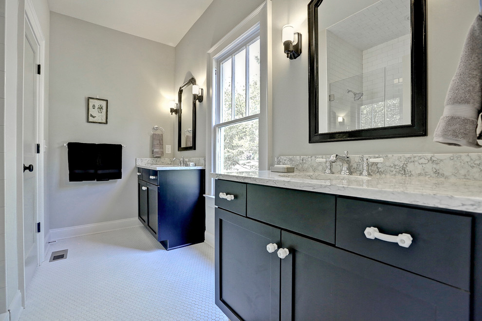Photo of a mid-sized traditional master bathroom in Atlanta with an undermount sink, shaker cabinets, black cabinets, engineered quartz benchtops, white tile, ceramic tile, grey walls and ceramic floors.