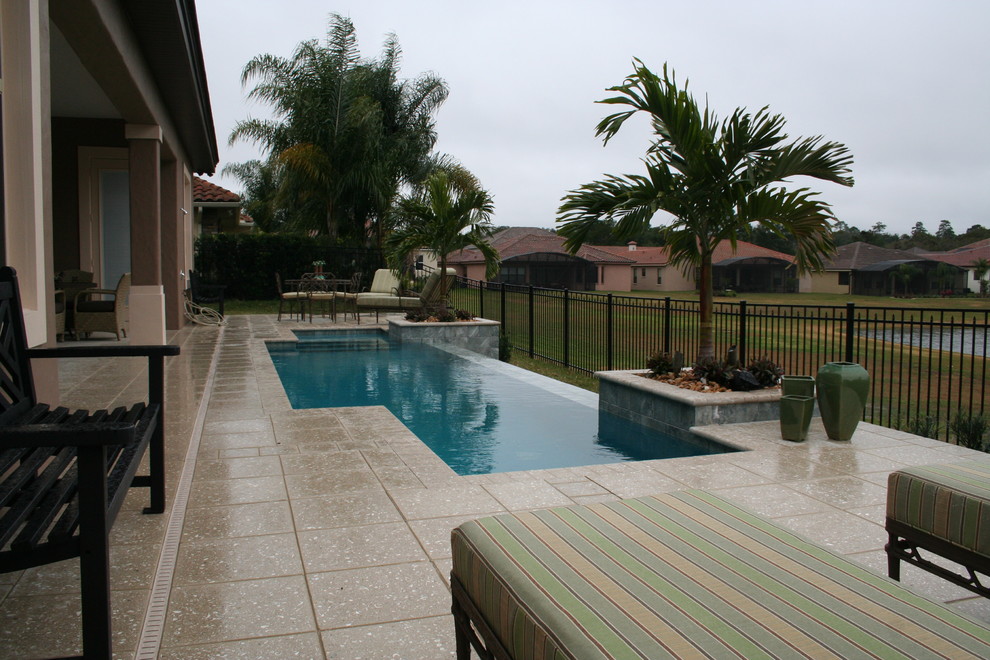 This is an example of a beach style pool in Orlando.