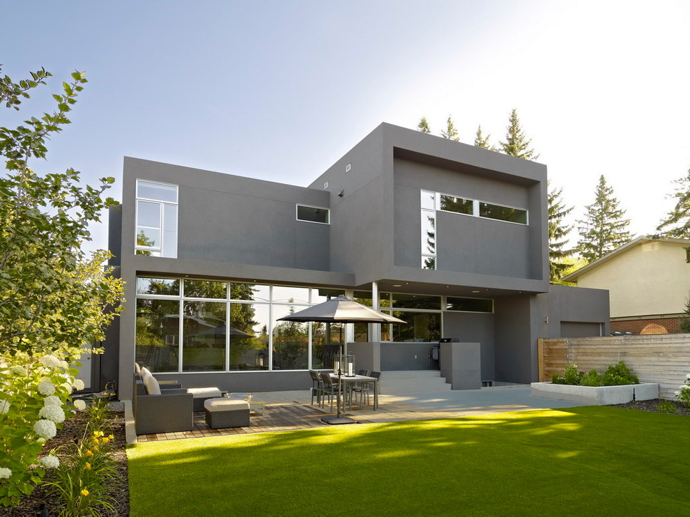 Inspiration for a mid-sized modern two-storey grey exterior in Edmonton.