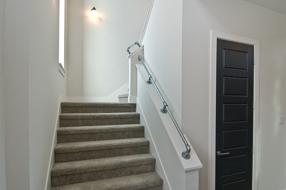 Design ideas for a contemporary carpeted l-shaped staircase in Dallas with carpet risers.