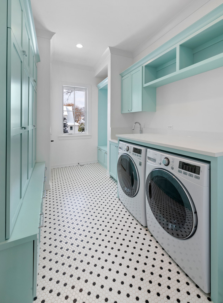 Design ideas for a large country galley dedicated laundry room in Chicago with an undermount sink, flat-panel cabinets, blue cabinets, quartz benchtops, white walls, ceramic floors, a side-by-side washer and dryer, white floor and white benchtop.