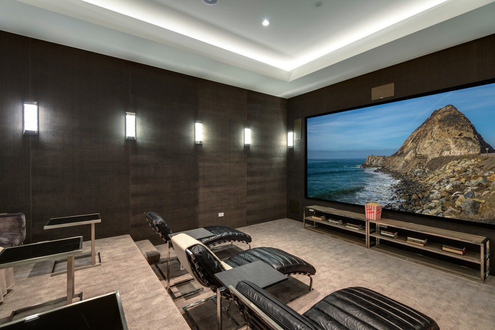 Contemporary enclosed home theatre in Los Angeles with brown walls, carpet and a projector screen.