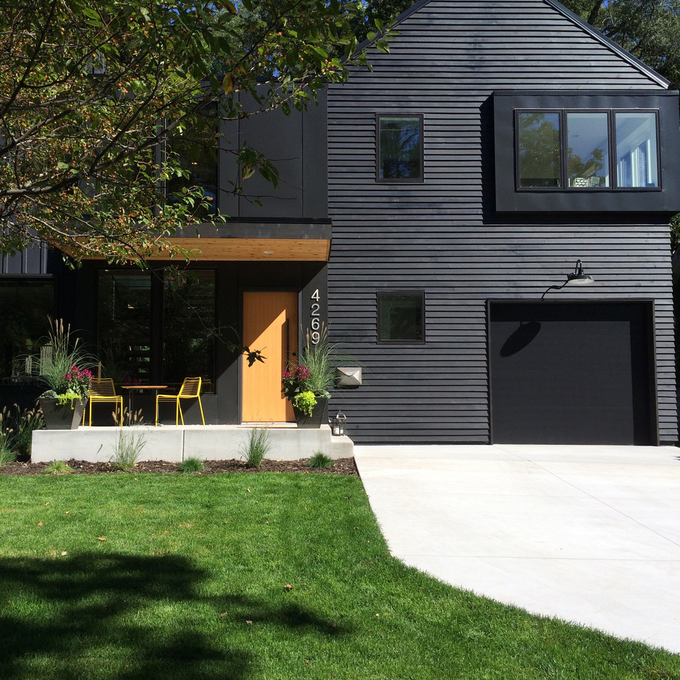 This is an example of a modern exterior in Minneapolis with mixed siding.