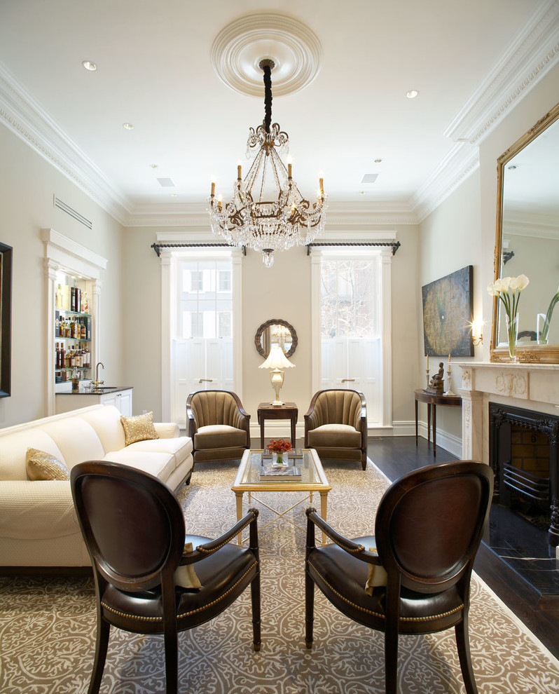 Large traditional formal enclosed living room in New York with beige walls, dark hardwood floors and no tv.