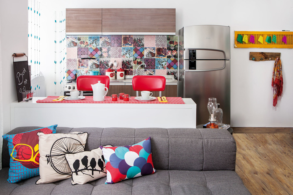 Eclectic galley open concept kitchen photo with multicolored backsplash and a peninsula