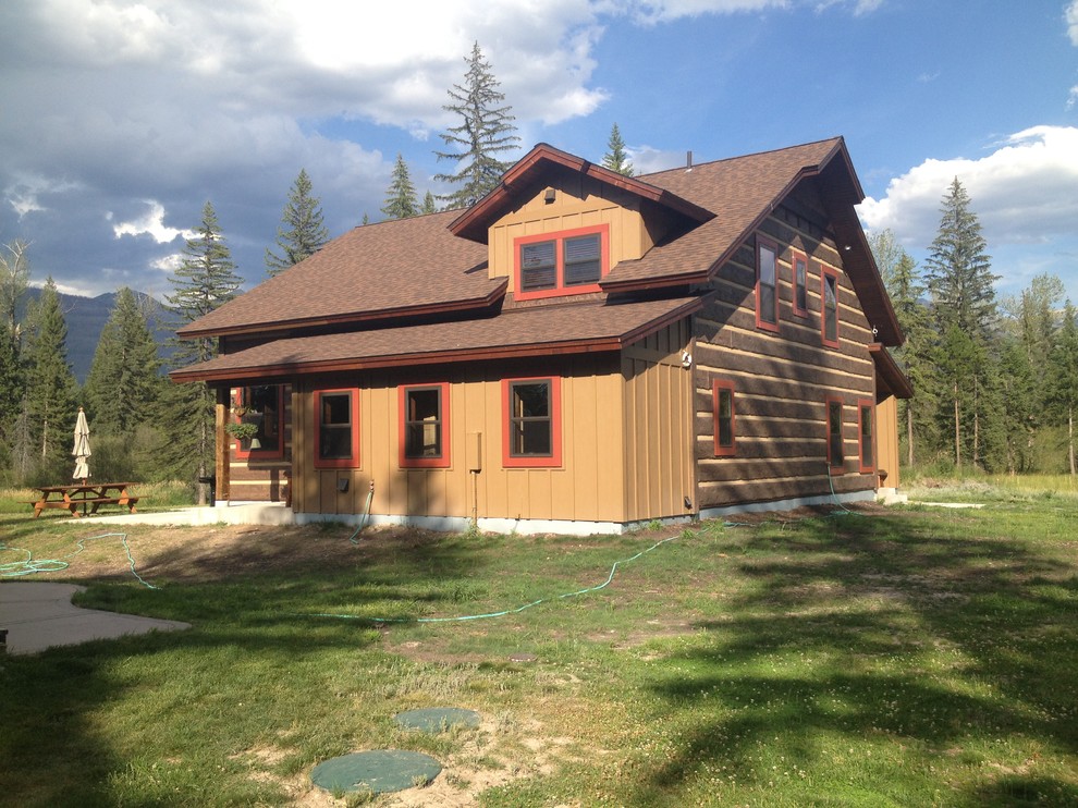 Mid-sized rustic brown two-story wood gable roof idea with a shingle roof