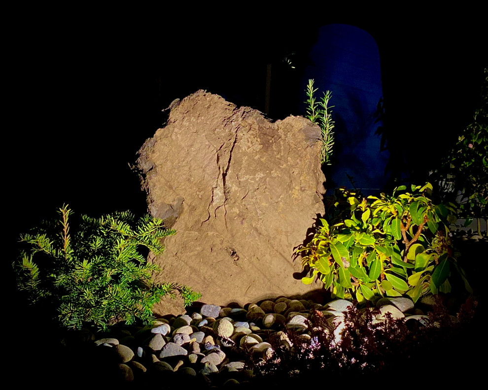 Photo of a rustic rock and partial sun river rock landscaping in Vancouver.