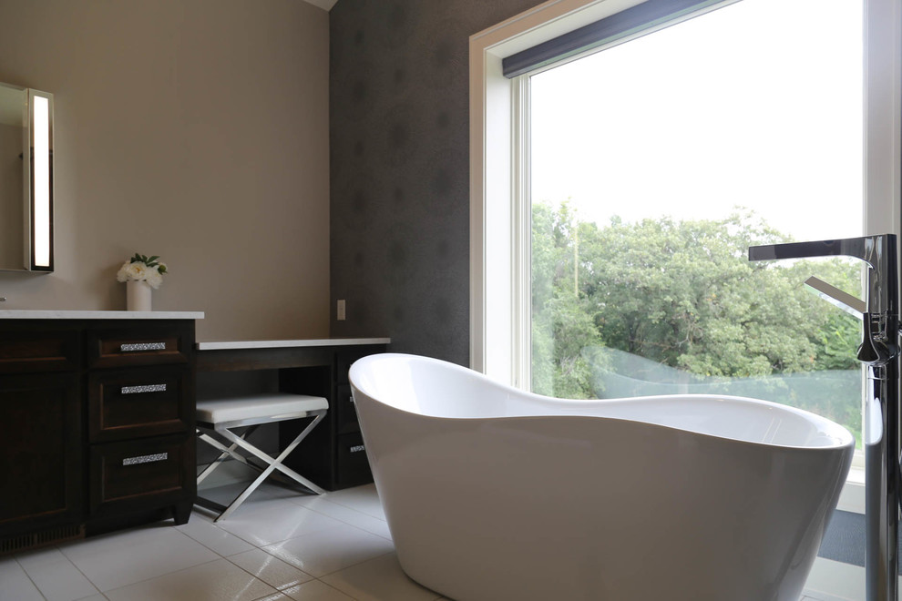 Freestanding bathtub - mid-sized transitional master white tile and porcelain tile porcelain tile and white floor freestanding bathtub idea with recessed-panel cabinets, dark wood cabinets, a two-piece toilet, gray walls, an undermount sink, quartzite countertops, a hinged shower door and white countertops