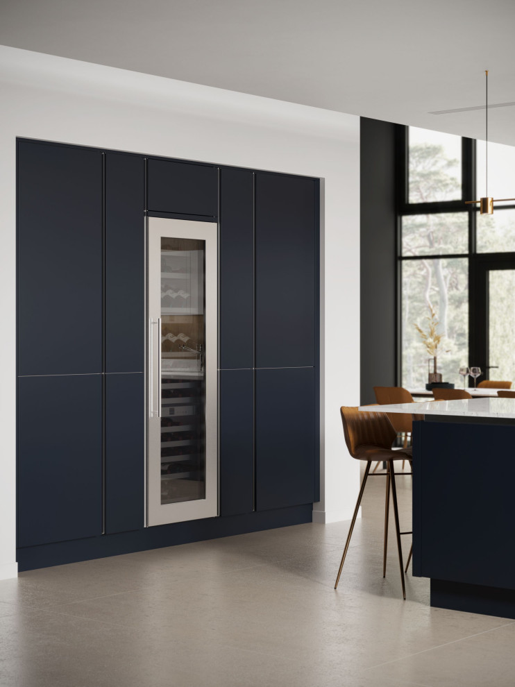 Inspiration for a large modern single-wall open plan kitchen in Essex with a built-in sink, flat-panel cabinets, grey cabinets, quartz worktops, white splashback, stone slab splashback, black appliances, porcelain flooring, an island, beige floors, white worktops, a vaulted ceiling and a feature wall.