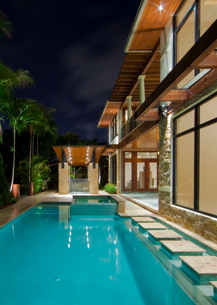 Design ideas for a contemporary backyard pool in Miami.