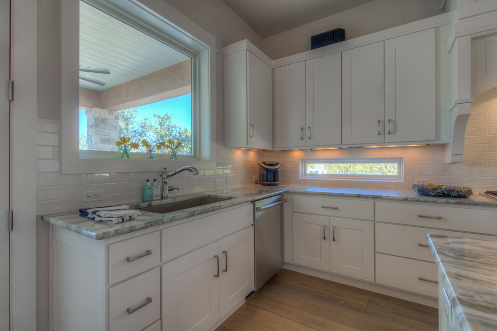 Eat-in kitchen - transitional eat-in kitchen idea in Austin with an island