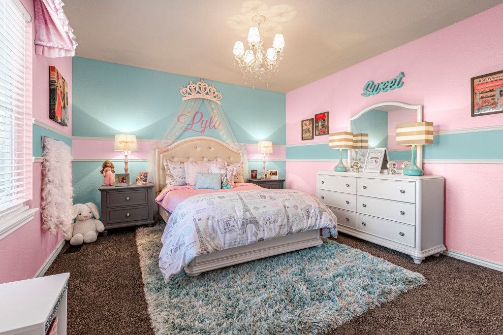 Design ideas for a mid-sized contemporary kids' bedroom for kids 4-10 years old and girls in Denver with pink walls, carpet and beige floor.