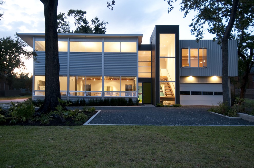 This is an example of a contemporary exterior in Houston with metal siding.