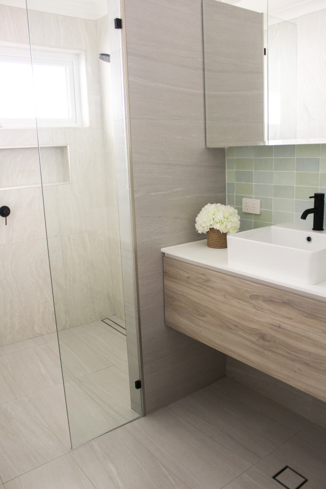 This is an example of a large modern 3/4 bathroom in Perth with flat-panel cabinets, light wood cabinets, an open shower, porcelain tile, grey walls, porcelain floors, a vessel sink, engineered quartz benchtops, grey floor, an open shower, white benchtops, a single vanity and a floating vanity.