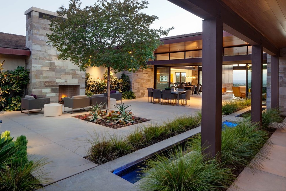 Design ideas for a contemporary patio in San Diego with no cover and with fireplace.