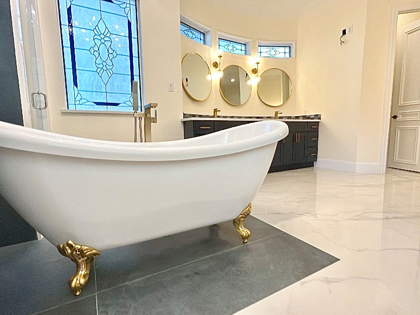 Example of a master blue tile and porcelain tile porcelain tile and double-sink claw-foot bathtub design in Dallas with shaker cabinets, blue cabinets, an undermount sink, quartz countertops and a bui