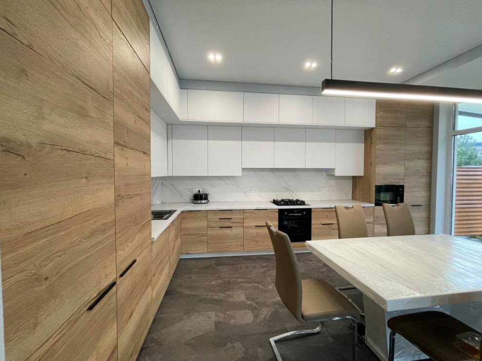 Photo of a large contemporary l-shaped eat-in kitchen in Other.