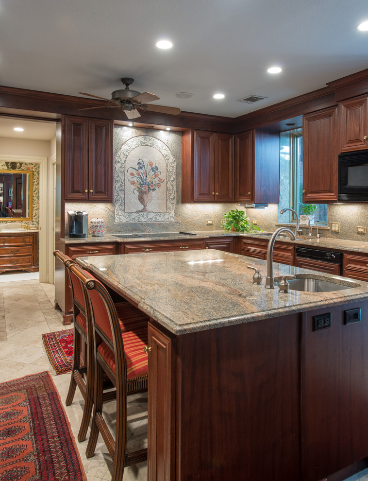 Design ideas for a large traditional kitchen in Other with an undermount sink, raised-panel cabinets, dark wood cabinets, granite benchtops, mosaic tile splashback, panelled appliances, limestone floors, with island and beige floor.