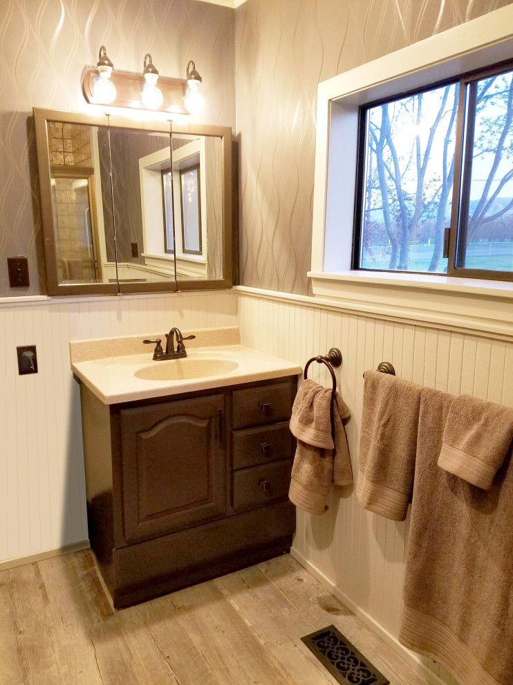 Photo of a small transitional 3/4 bathroom in Seattle with dark wood cabinets and a built-in vanity.