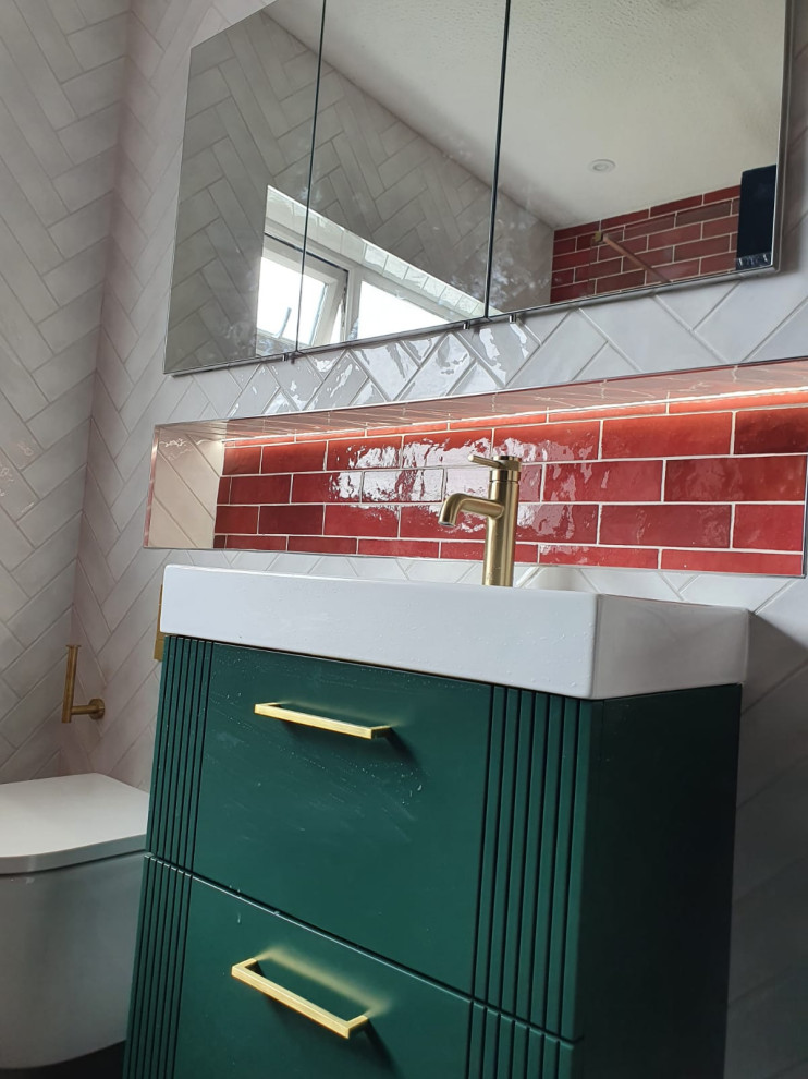 Inspiration for a mid-sized contemporary master white tile and porcelain tile porcelain tile, black floor and single-sink bathroom remodel in Dublin with furniture-like cabinets, green cabinets, a wall-mount toilet, red walls, a drop-in sink and a floating vanity