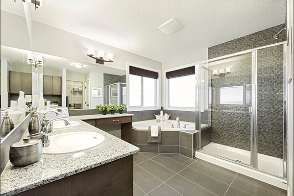 Photo of a large contemporary master bathroom in Calgary with engineered quartz benchtops, a corner tub, a corner shower, porcelain floors, a drop-in sink, medium wood cabinets, beige tile, mosaic tile and beige walls.