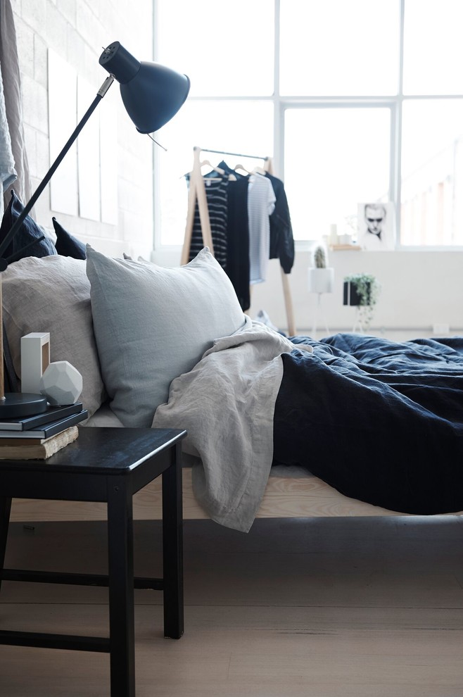 This is an example of a mid-sized scandinavian bedroom in Melbourne.