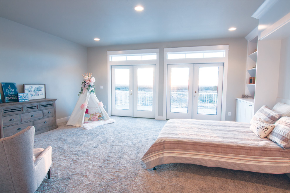 This is an example of a large arts and crafts gender-neutral kids' playroom in Seattle with grey walls and carpet.