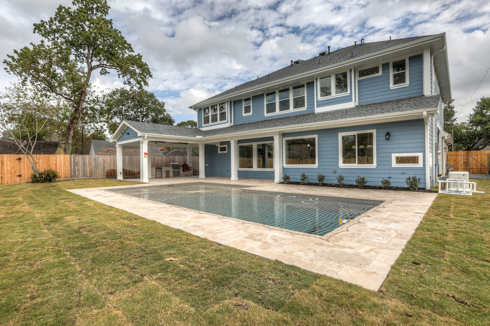 Large transitional blue two-story concrete fiberboard gable roof photo in Houston with a shingle roof