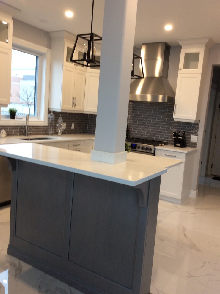 Kitchen - kitchen idea with an undermount sink, quartz countertops, an island and white countertops