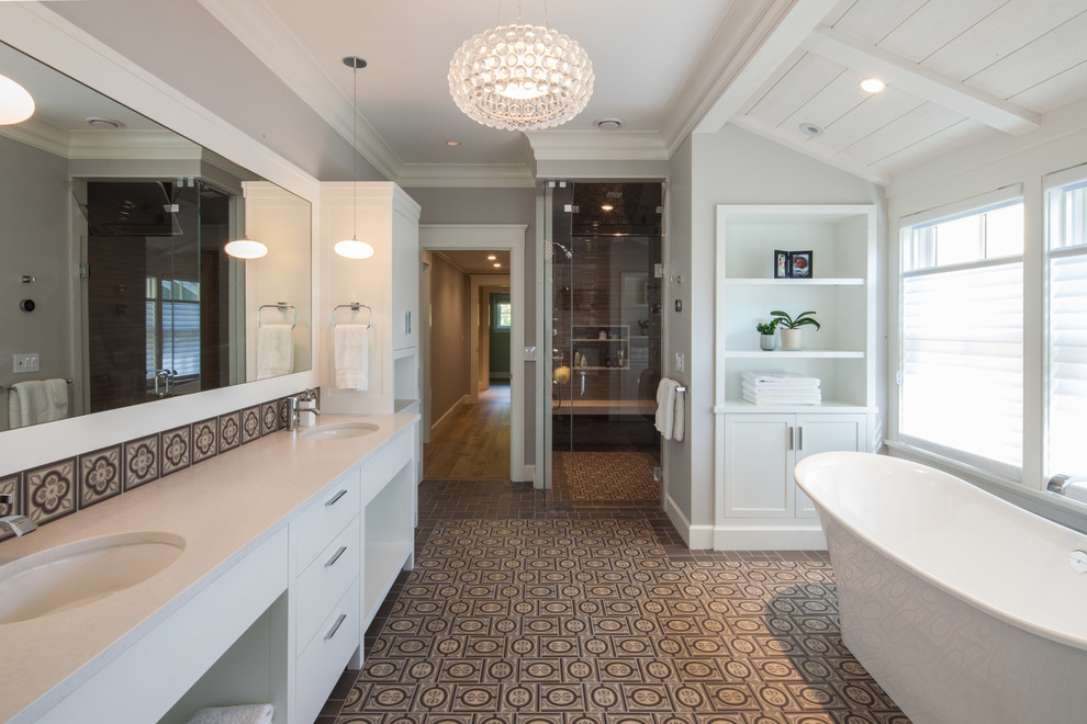 Design ideas for a traditional bathroom in Boston with an undermount sink, flat-panel cabinets, white cabinets, a freestanding tub, a curbless shower, multi-coloured tile and grey walls.