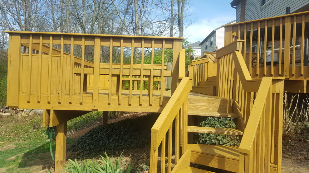 Inspiration for a large backyard deck remodel in Cincinnati with no cover