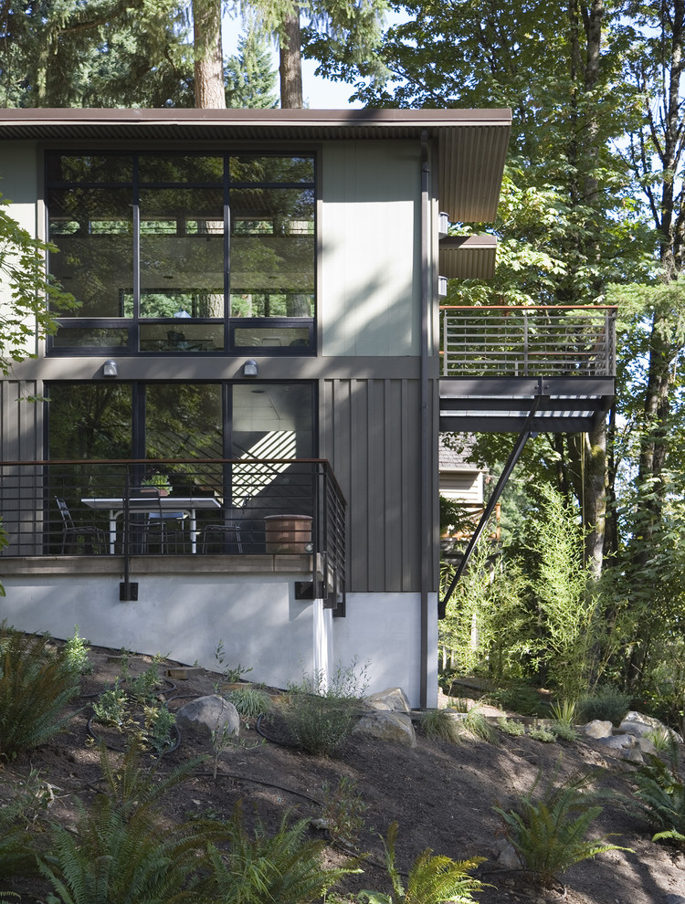 Design ideas for a contemporary two-storey exterior in Portland.
