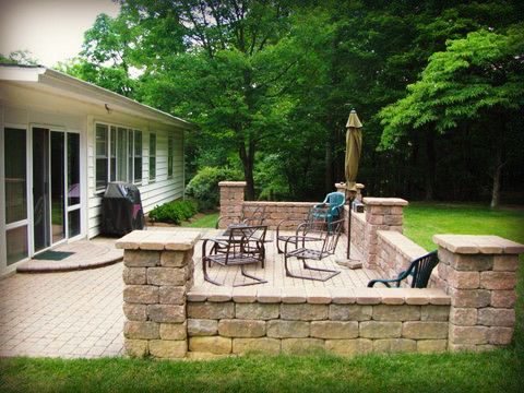 Patio kitchen - mid-sized rustic backyard concrete paver patio kitchen idea with no cover
