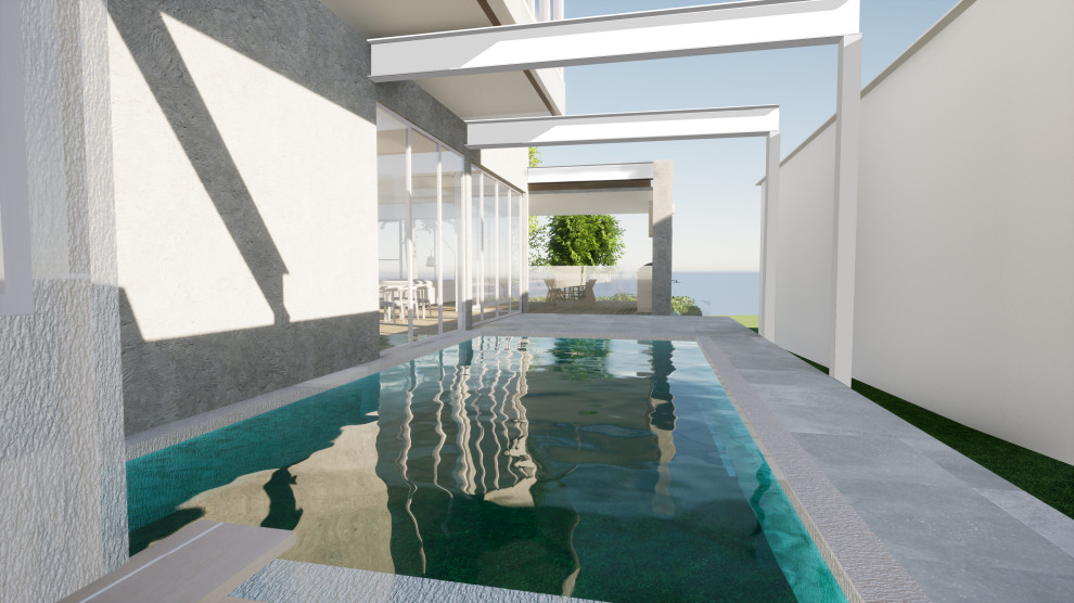 Diseño de piscina contemporánea grande rectangular en patio con privacidad y suelo de baldosas