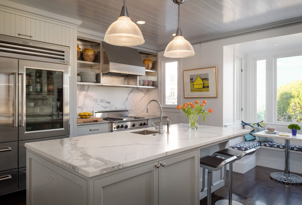 Design ideas for a transitional kitchen in San Francisco with stainless steel appliances, grey cabinets, marble benchtops and marble splashback.